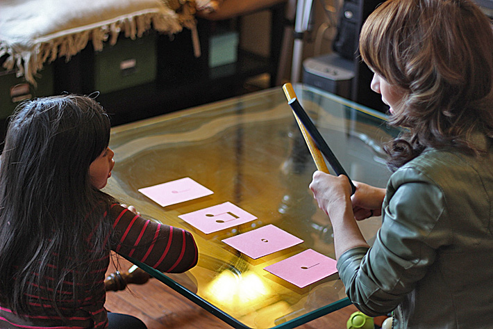 Teacher instructing child on music basics